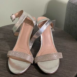 Silver ankle strap sandals with rhinestone accent
